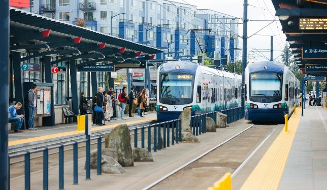 Photograph of light rail trains entering Othello Station.